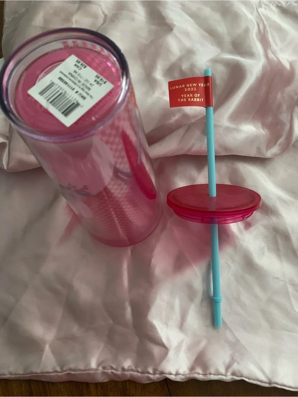 Starbucks Pink Tumbler with Light Blue Straw and Red Flag Detail